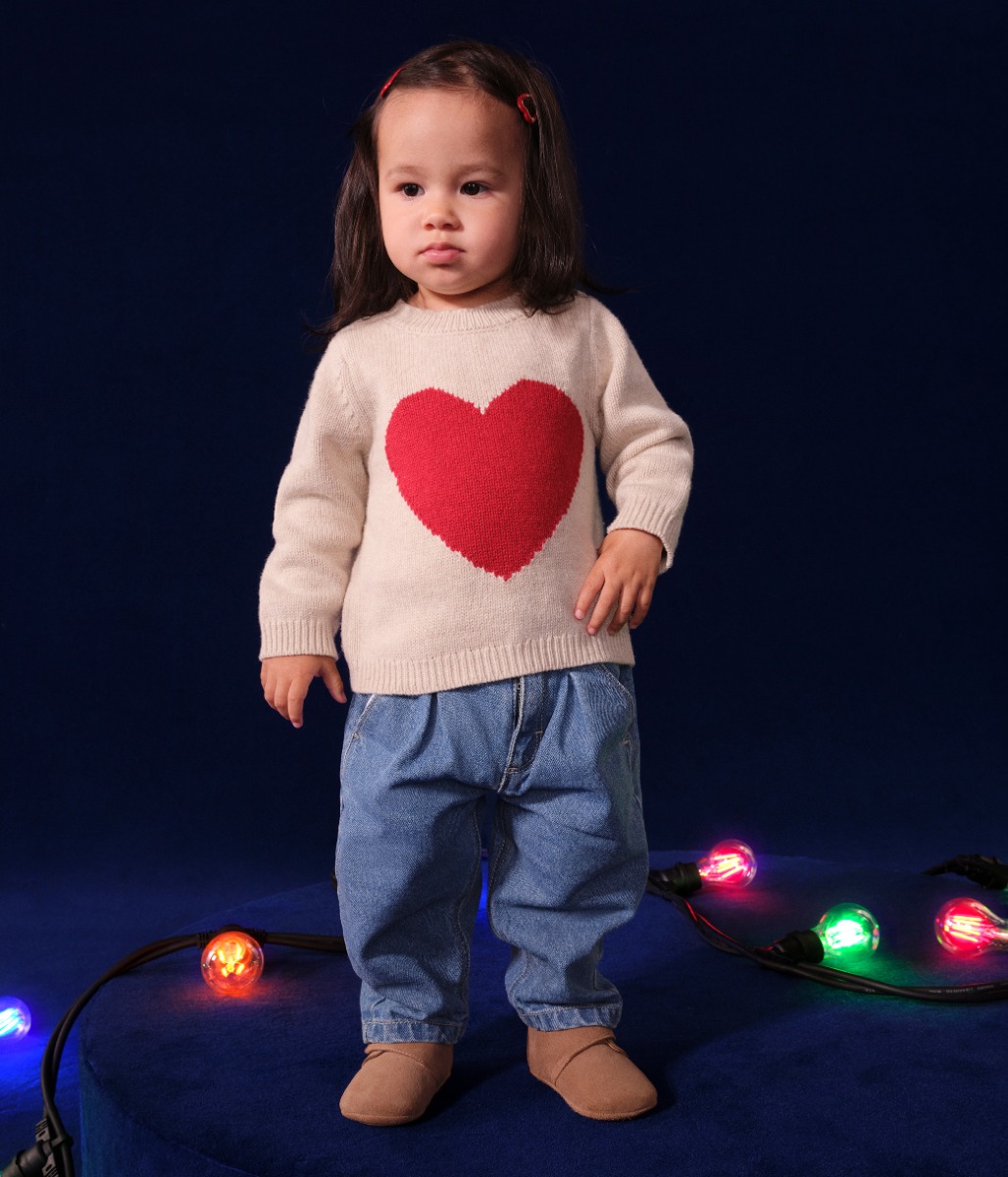 Babies' Knitted Jumper Containing Wool.