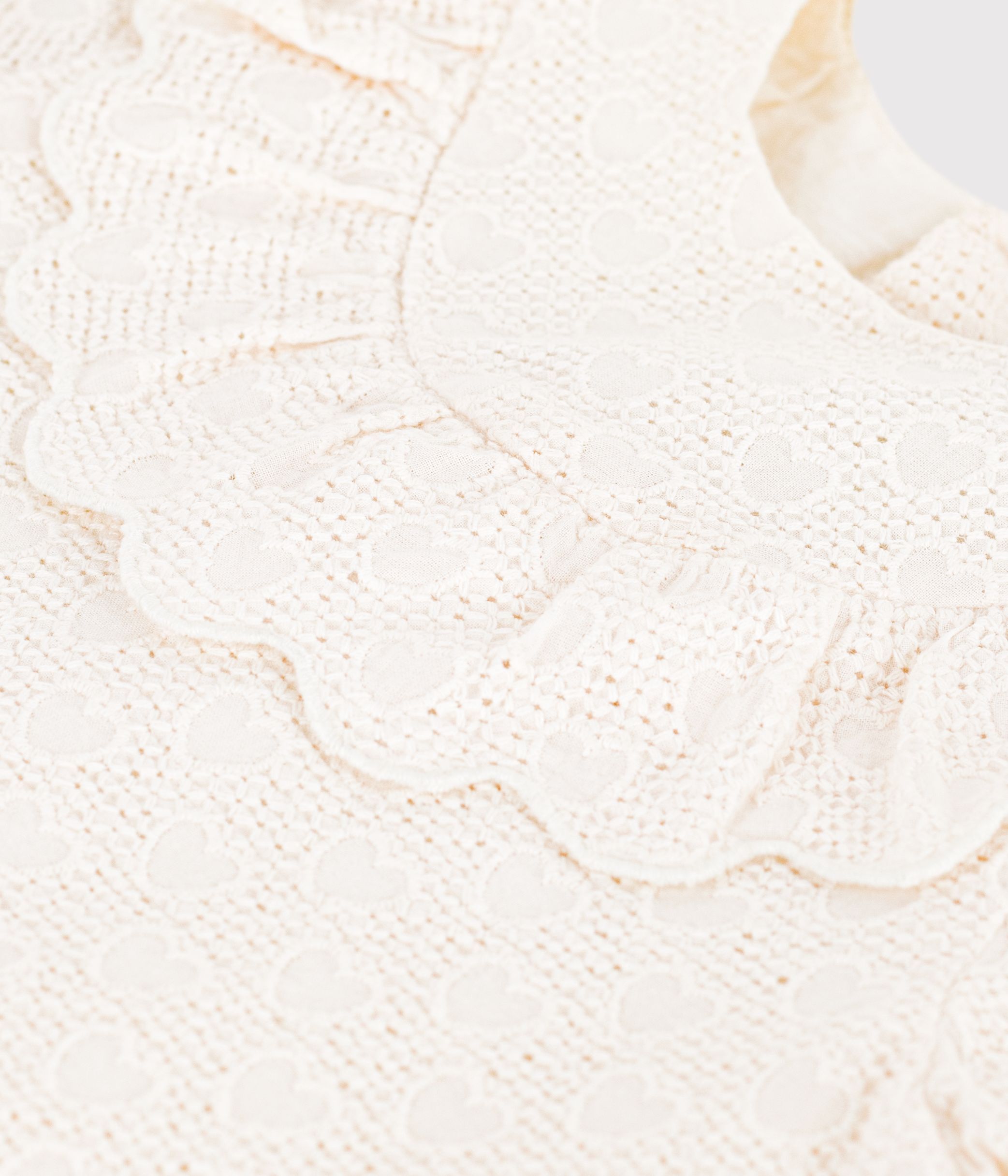 Babies' dress in broderie anglaise with short sleeves and a hearts motif