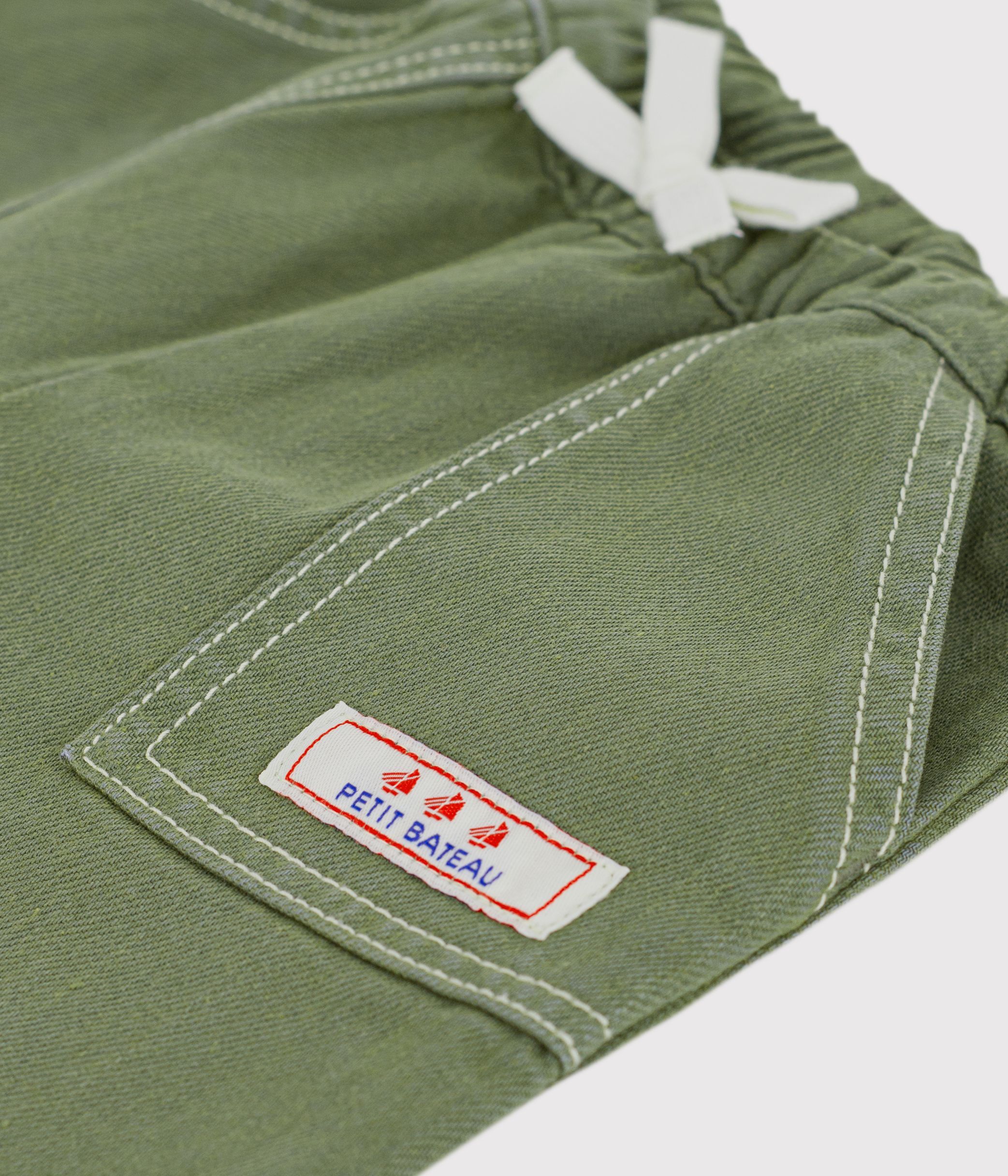 Babies' plain, coloured denim trousers