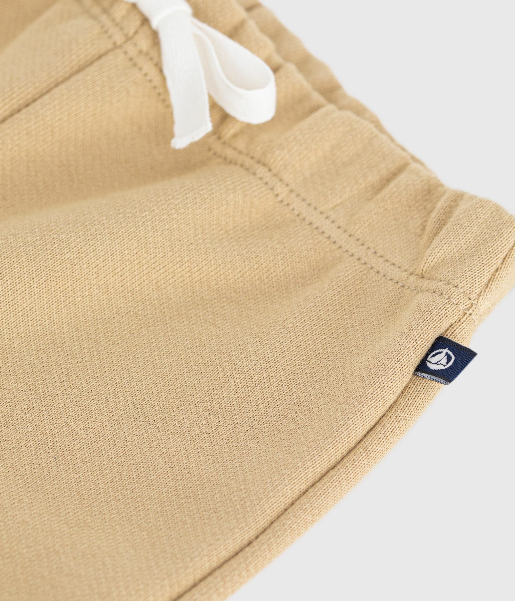 Babies' jogging bottoms in plain cotton