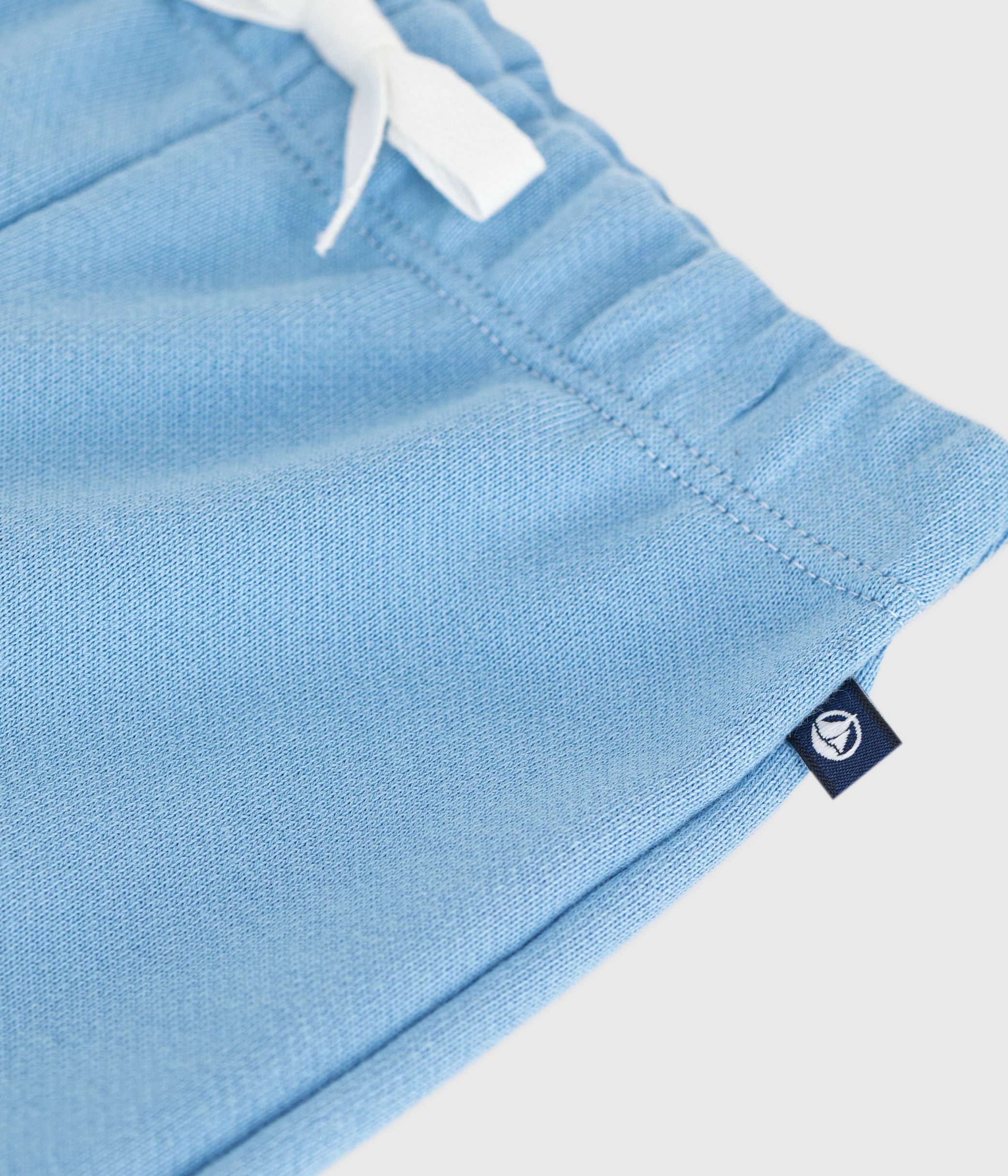 Babies' jogging bottoms in plain cotton